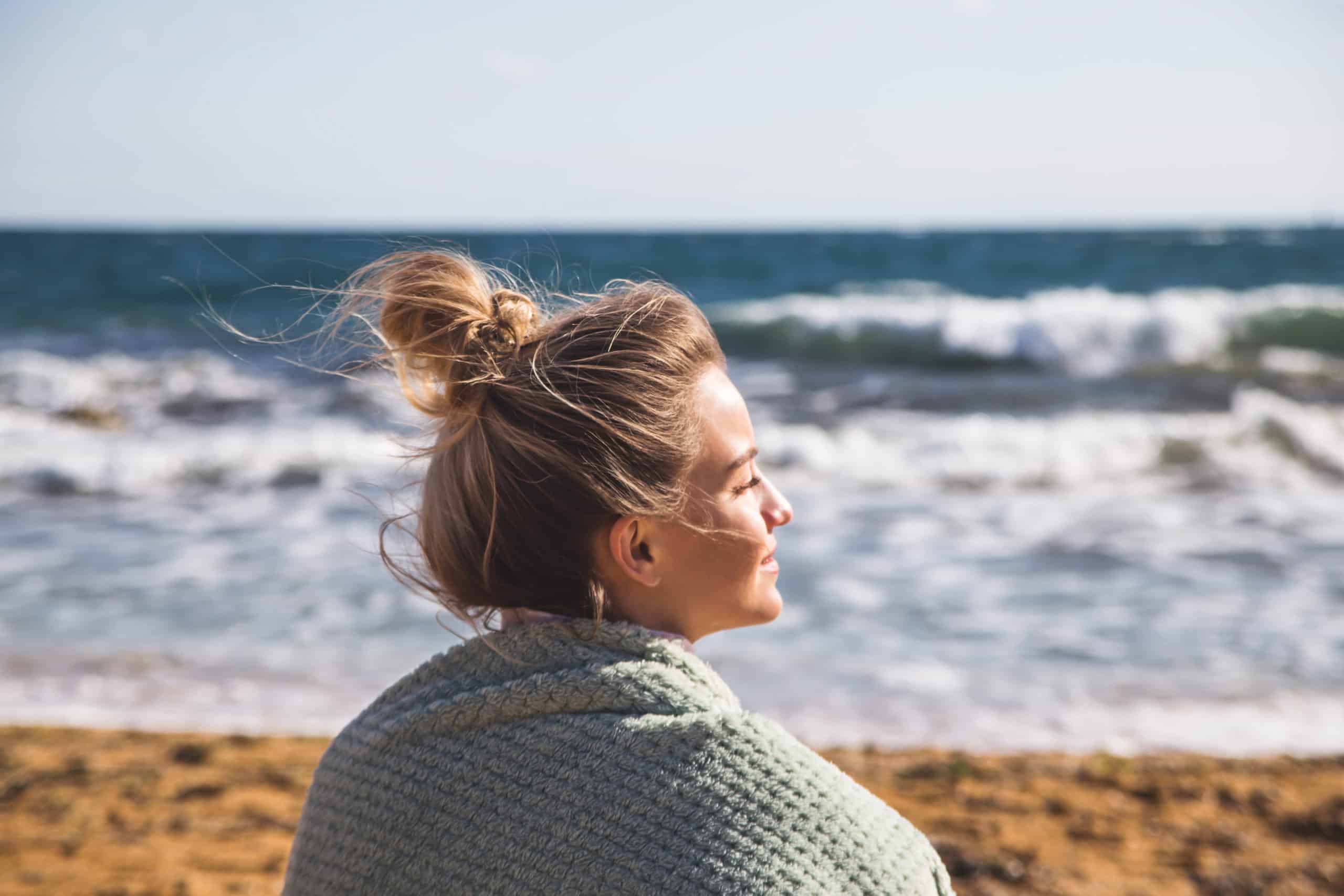 Woman sitting on the beach